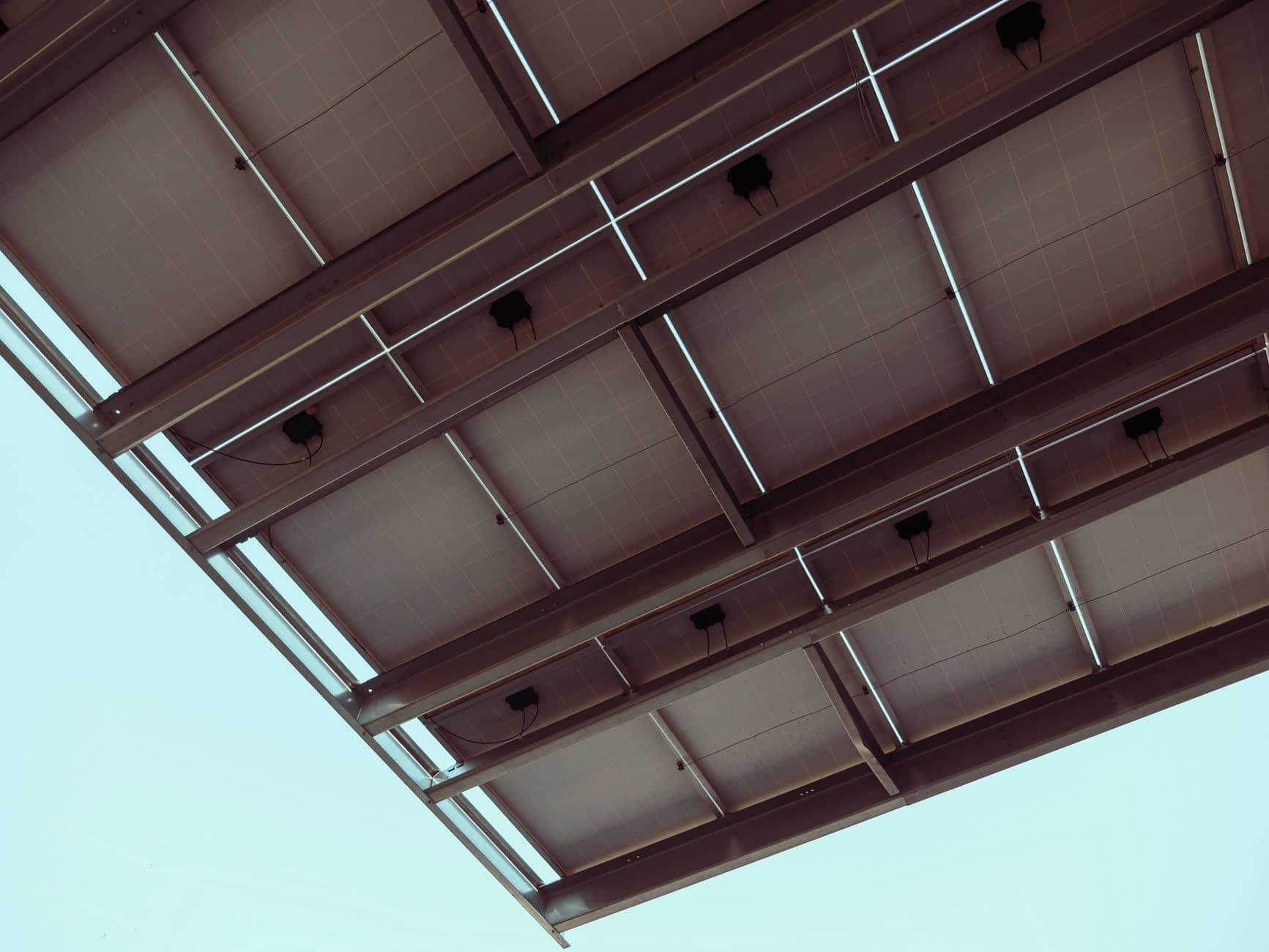 Close-up view of solar panels against a blue sky