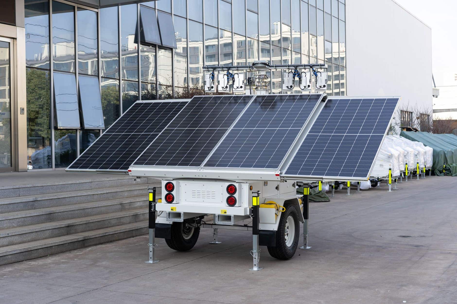Mobile solar panel trailer parked outdoors, illustrating portable solar power for events