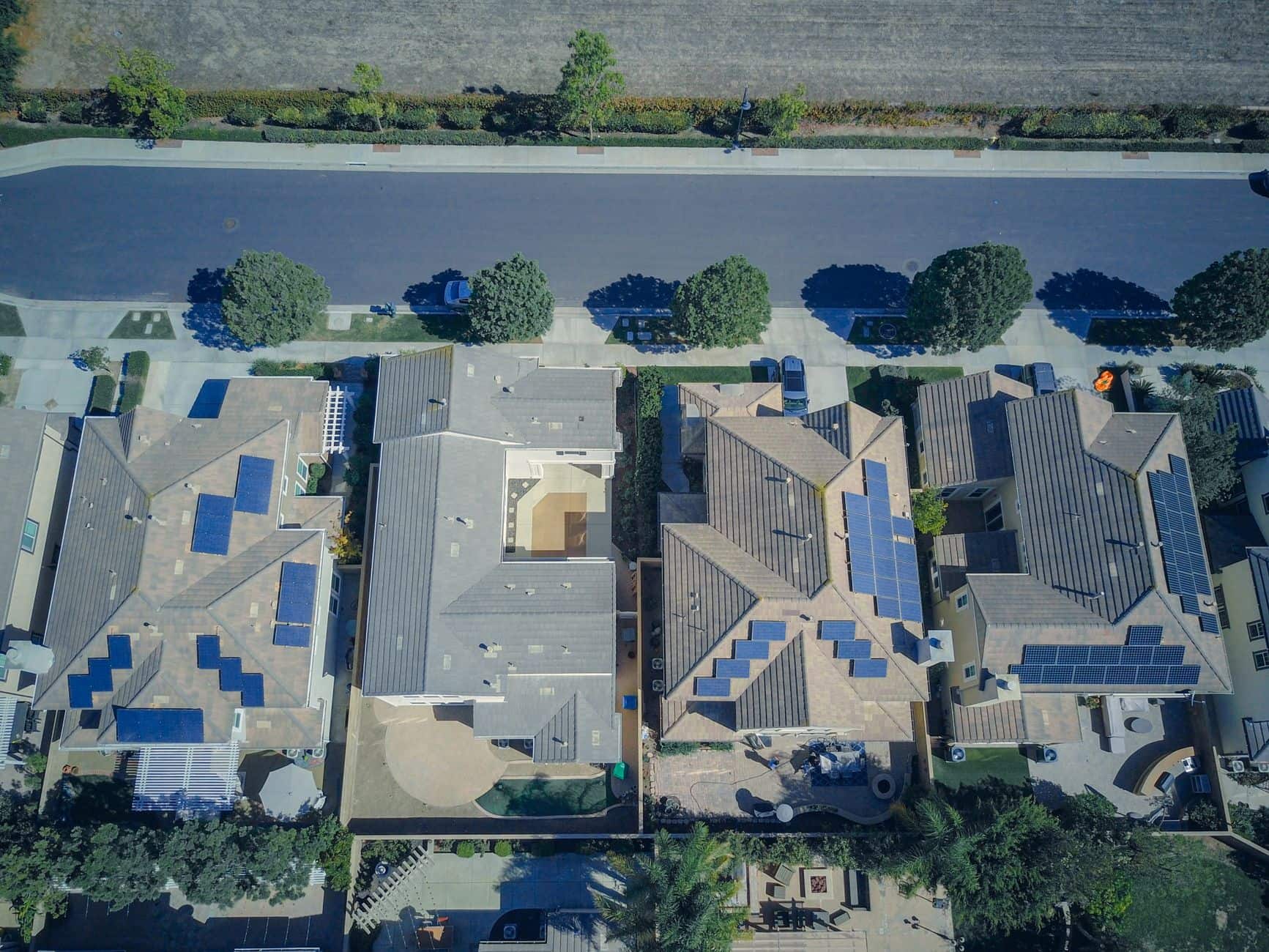 Aerial view of suburban houses with rooftop solar panels