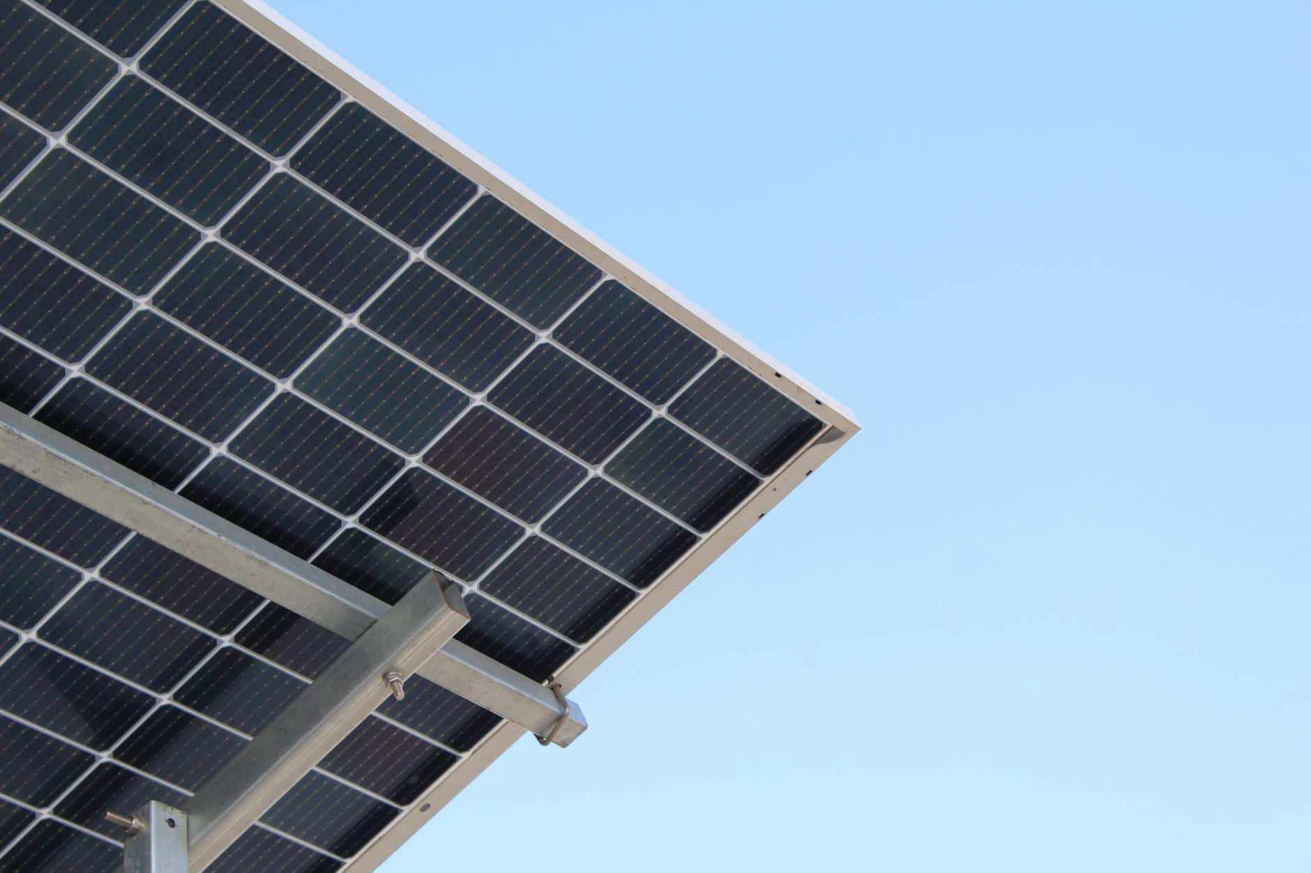 Modern solar panel against a clear blue sky