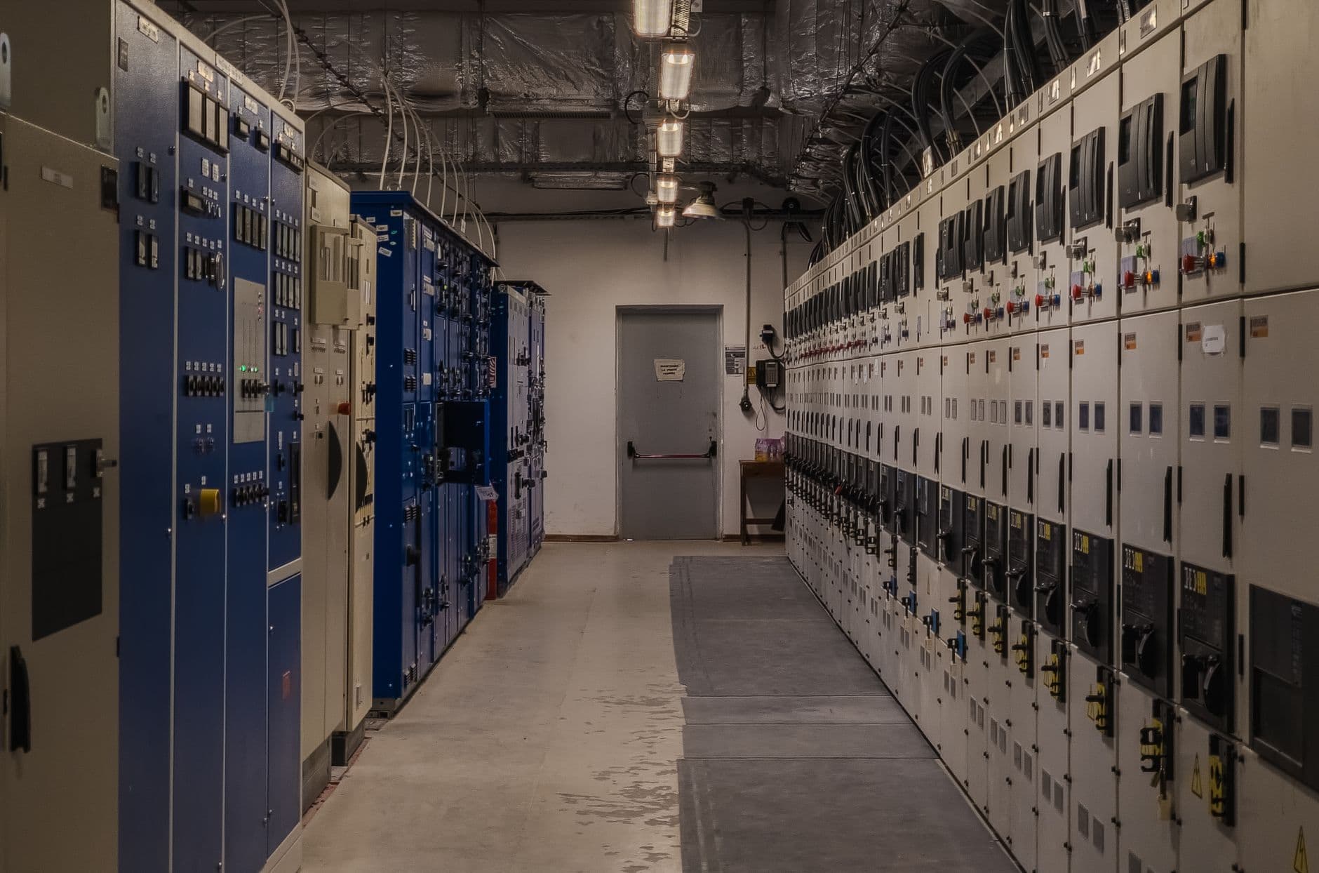 Control room with electrical panels and monitoring equipment for power grid management