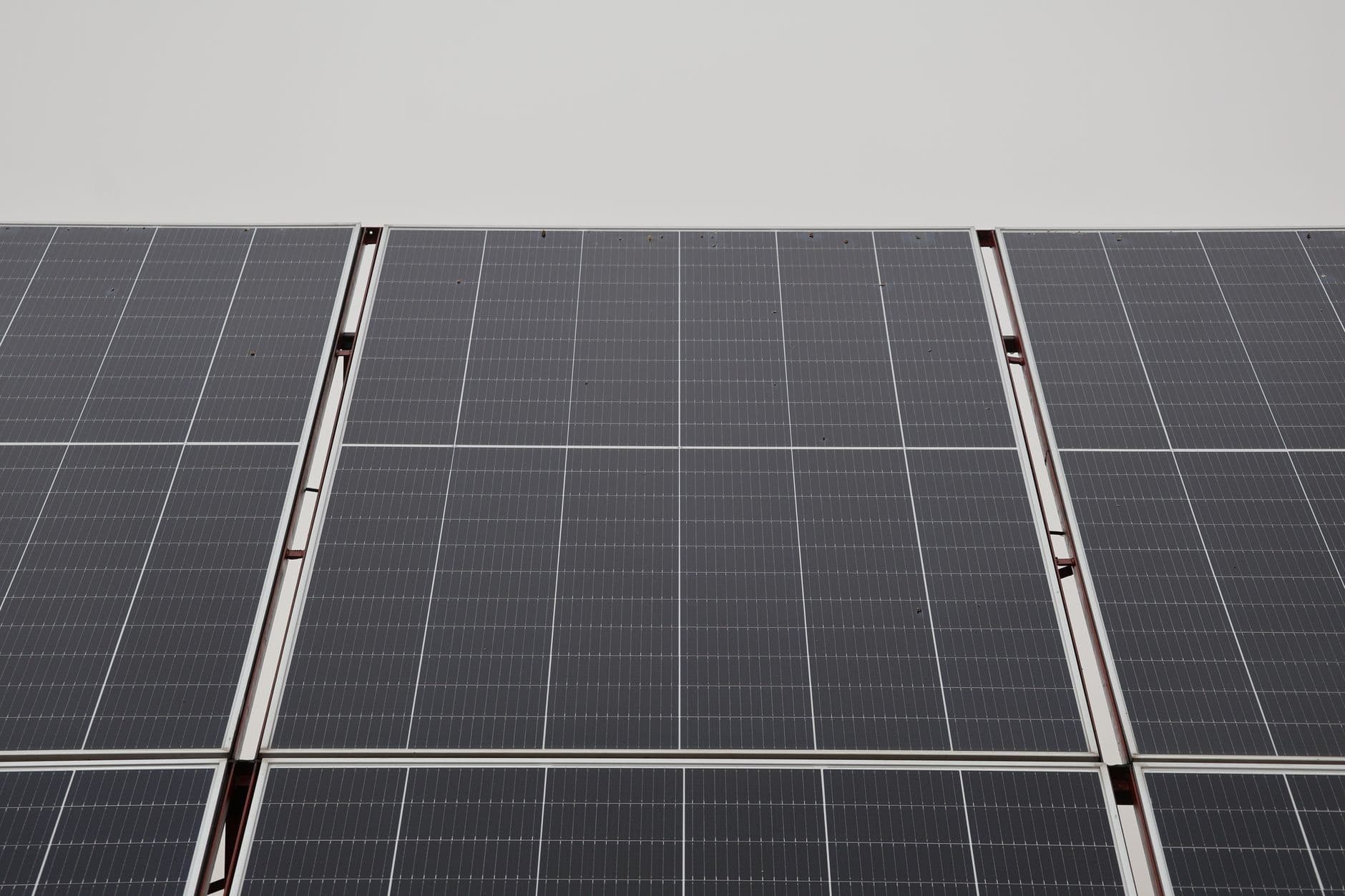 Close-up view of modern solar panels under an overcast sky