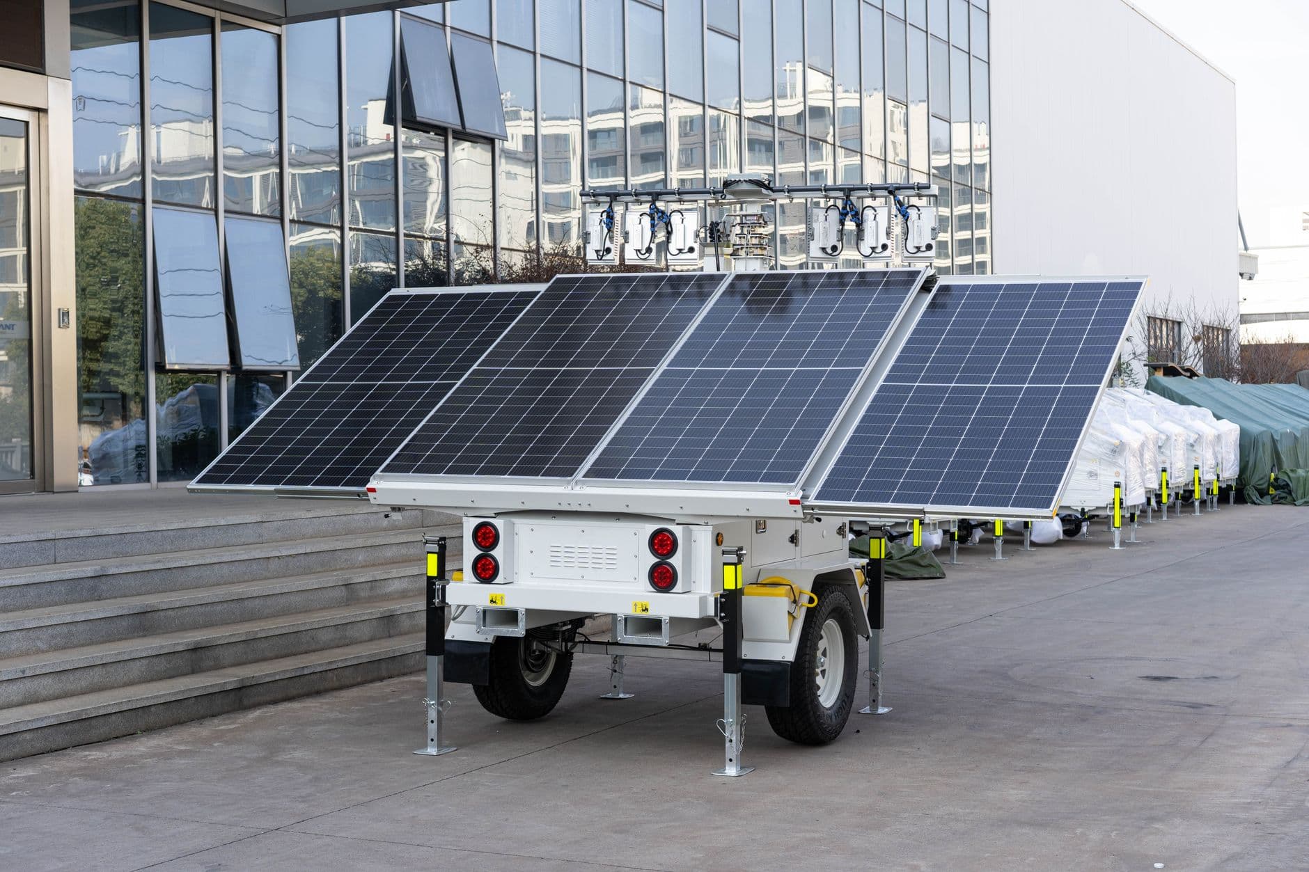 Mobile solar panel trailer parked outdoors, illustrating portable solar power for events