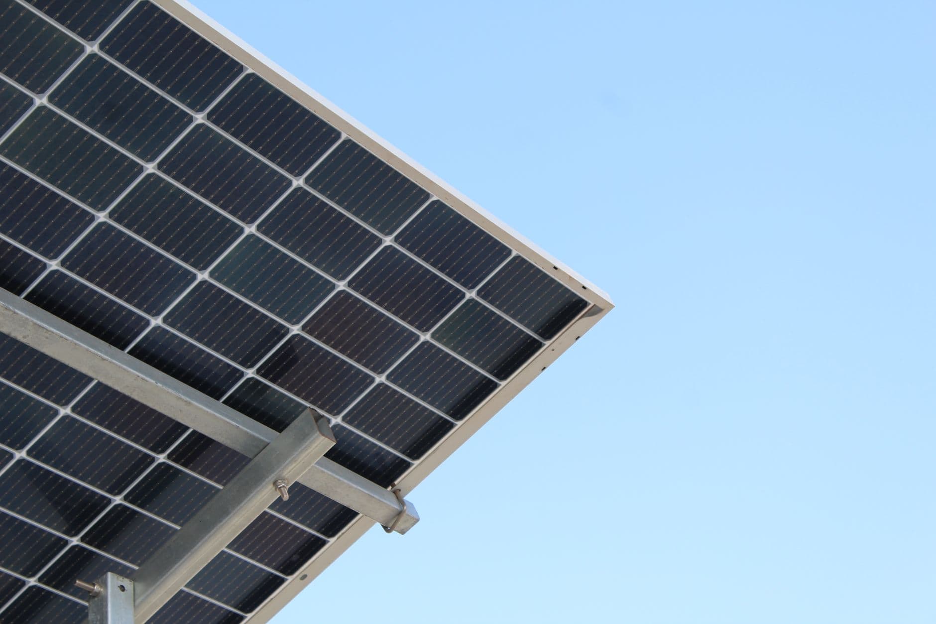 Modern solar panel against a clear blue sky