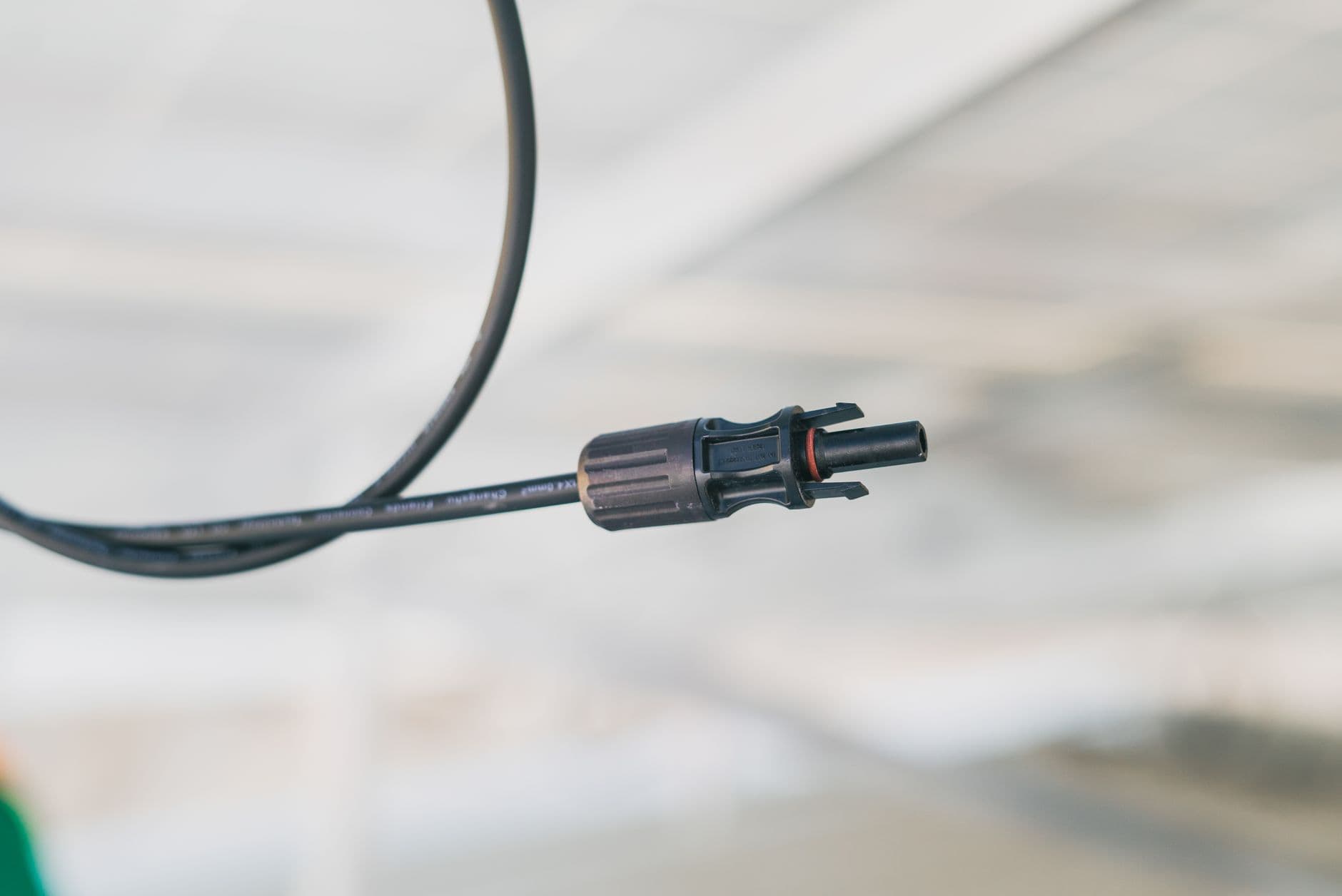 Close-up of an electrical connector cable used in solar installations
