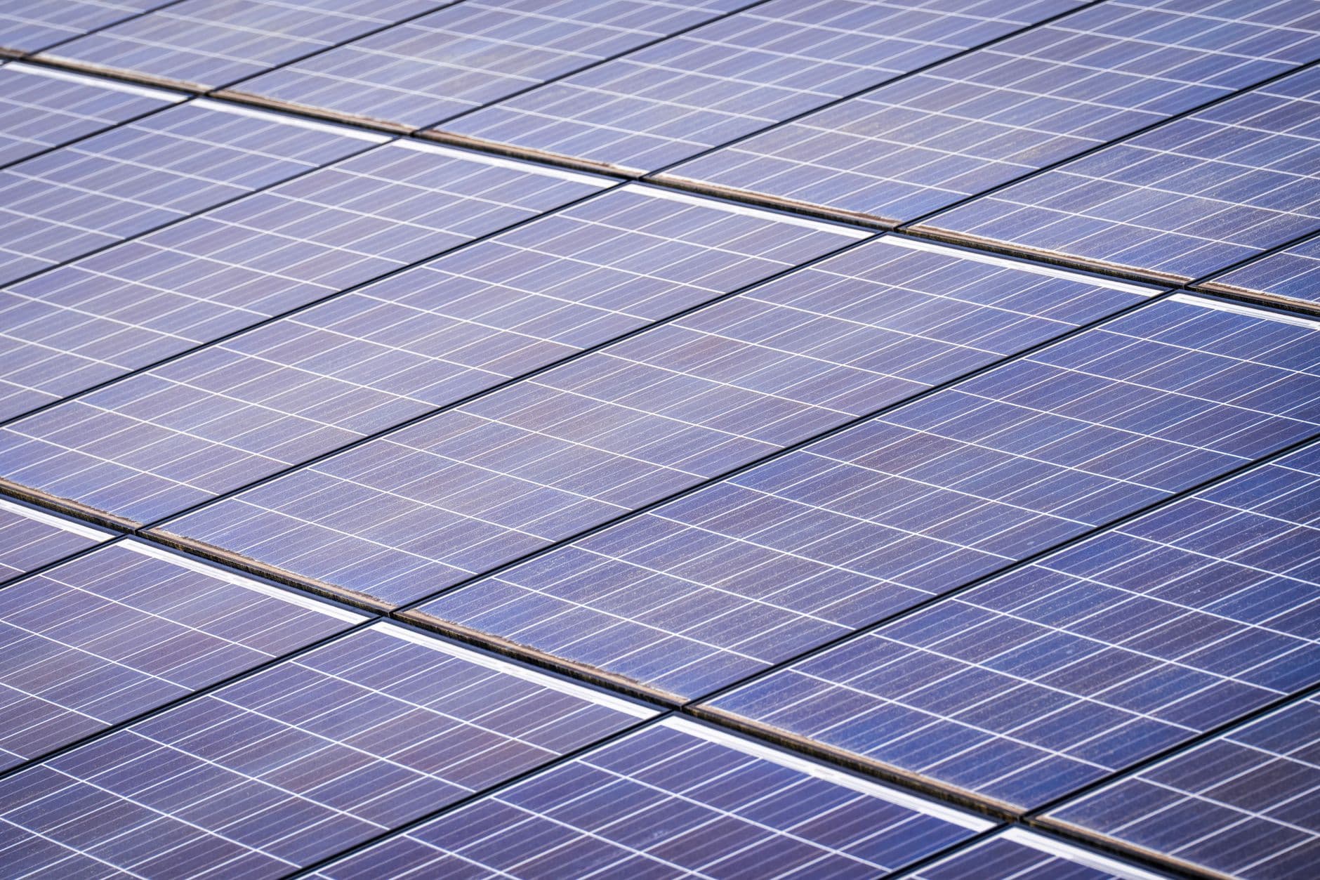 Close-up view of a solar panel array under bright sunlight