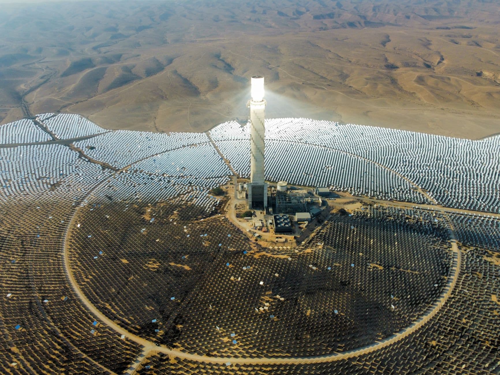 Aerial view of Israel's Ashalim solar power station in the Negev Desert with bright solar panels