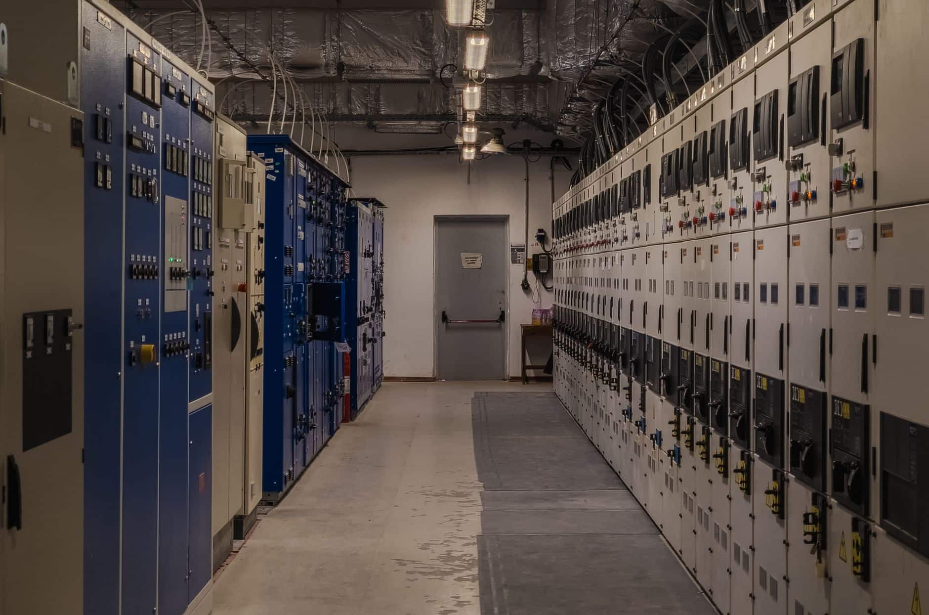 Control room with electrical panels and monitoring equipment for power grid management