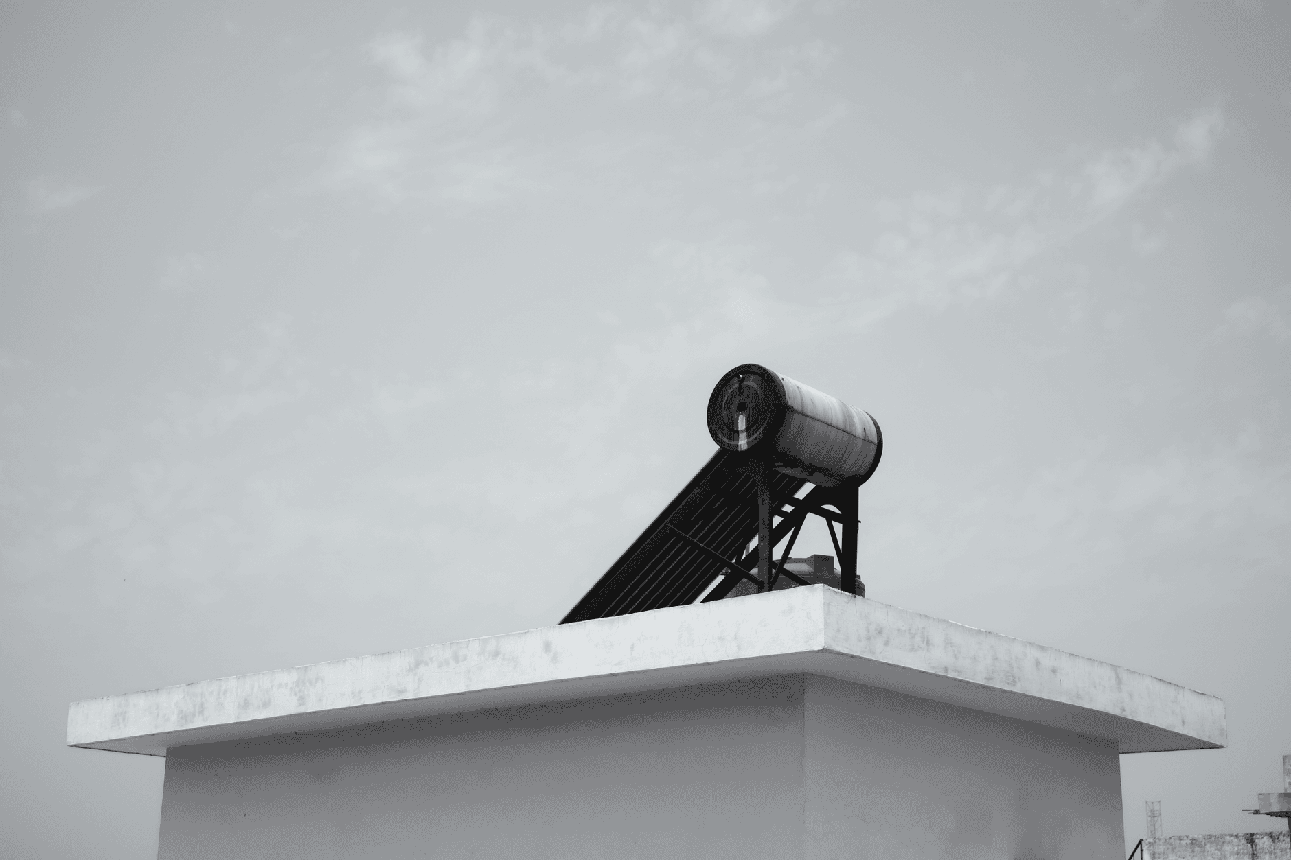 Solar water heater installed on a rooftop under a clear sky