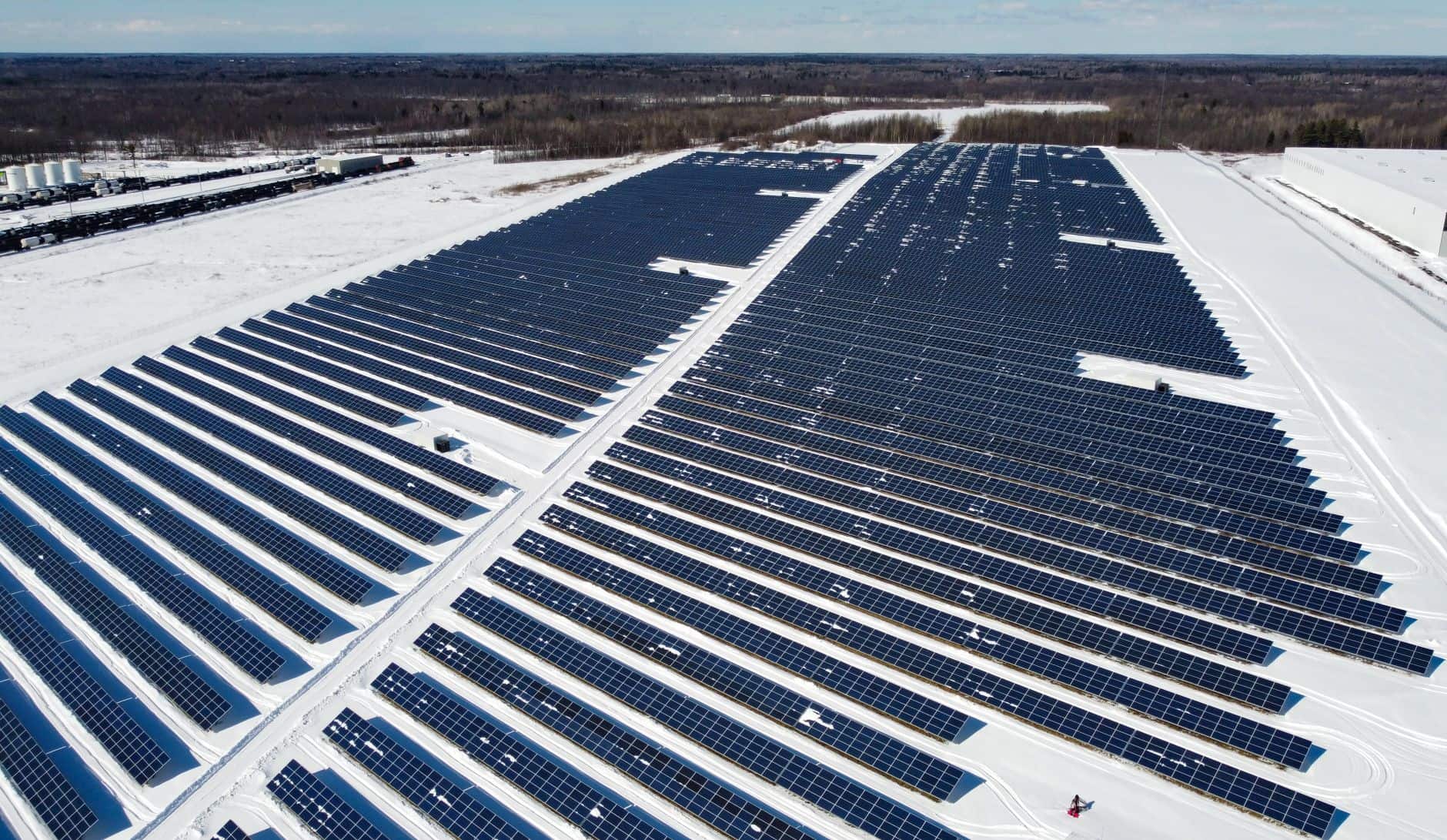 Drone view of a snowy solar farm in Canada