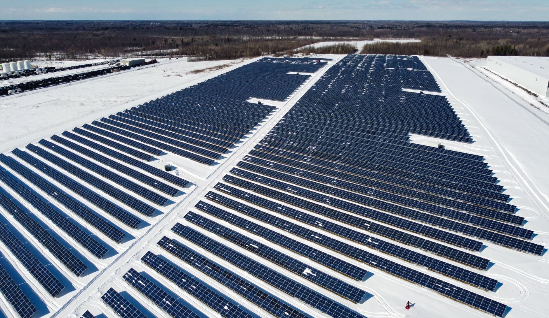 Drone view of a snowy solar farm in Canada