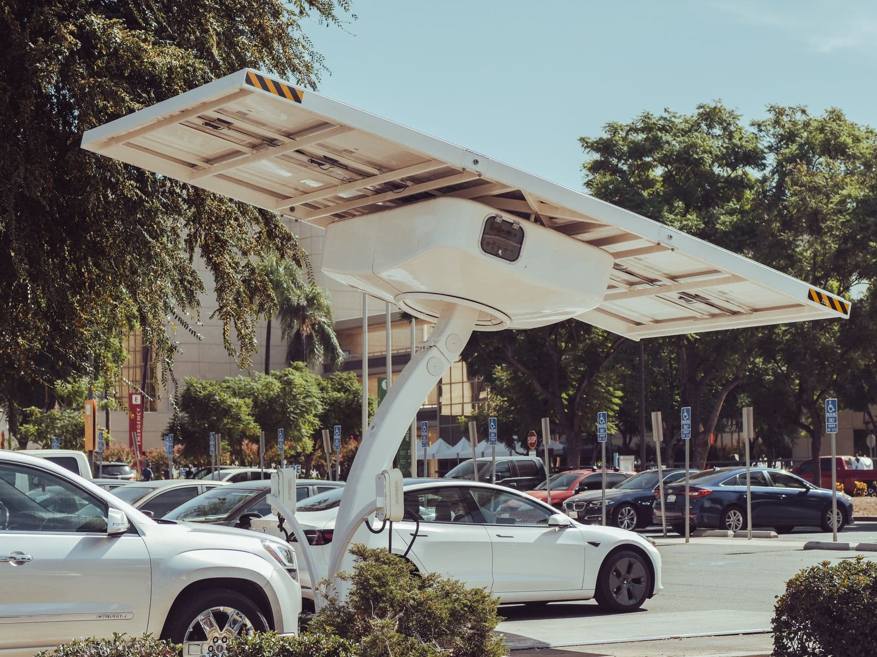 Modern solar-powered electric vehicle charging station on a sunny day