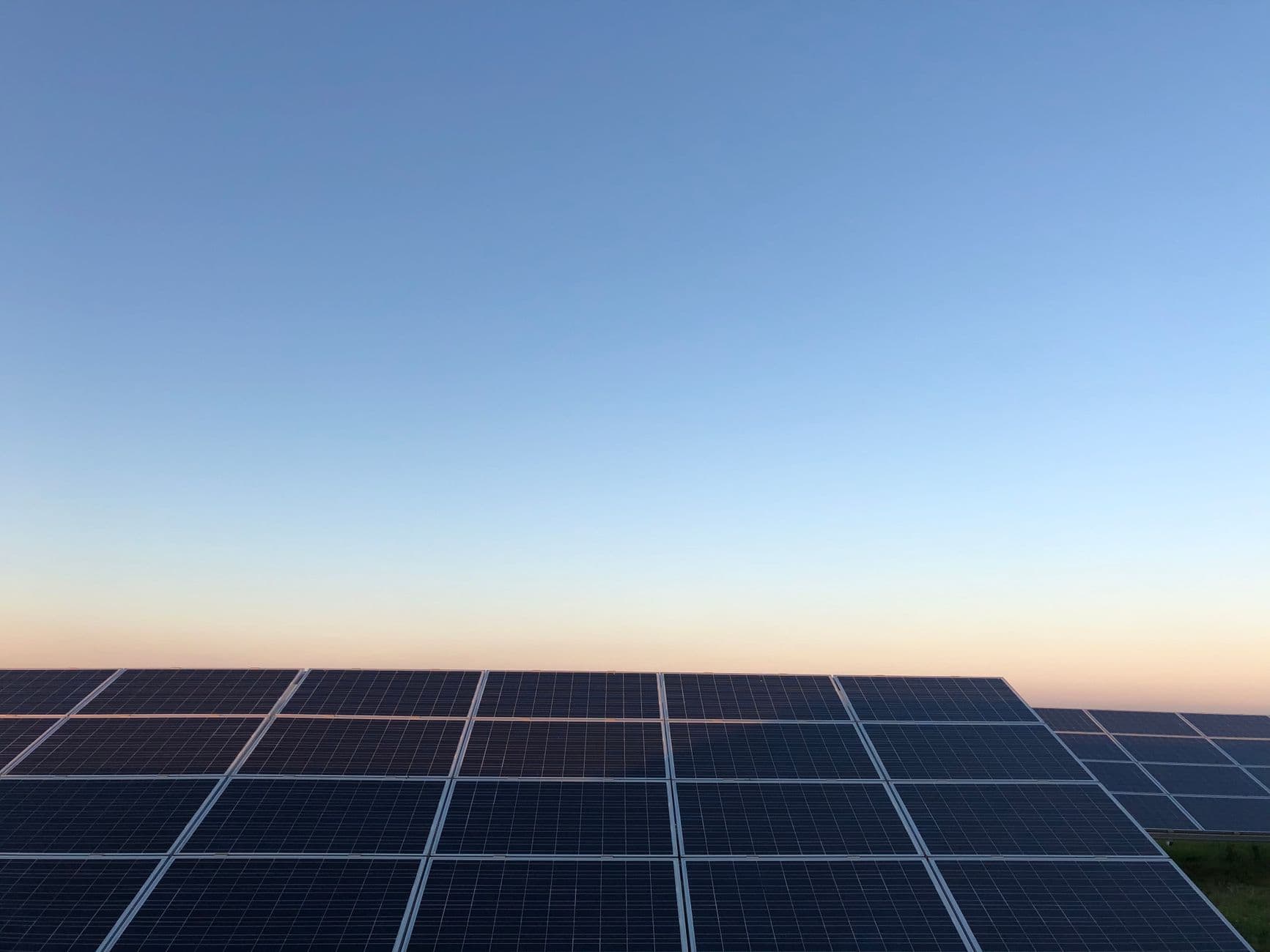Solar panels on a field near Andria, Italy at sunrise