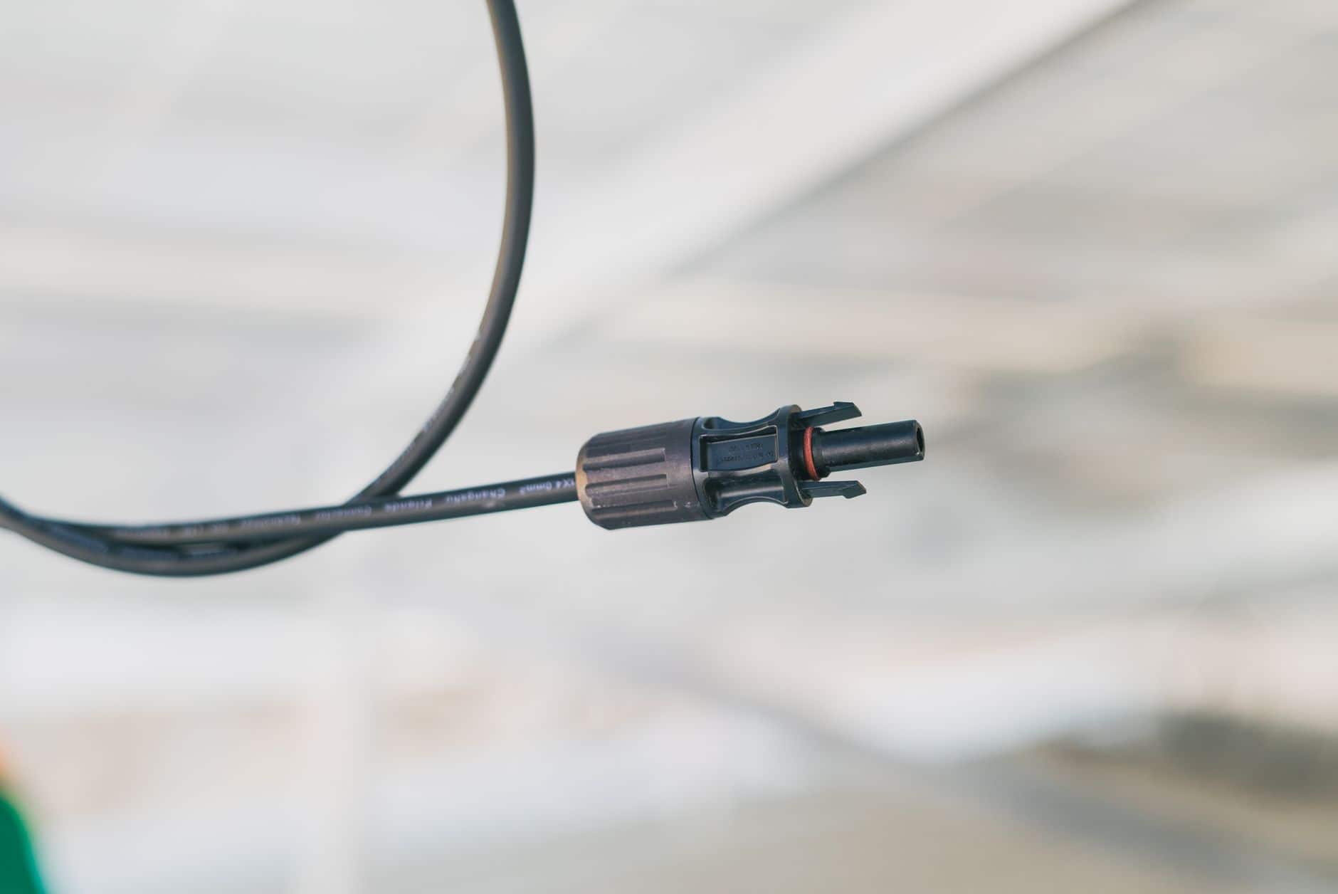 Close-up of an electrical connector cable used in solar installations